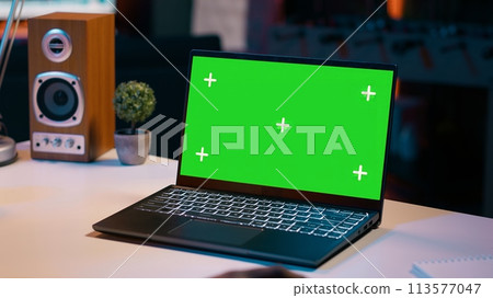 University student checks greenscreen display on laptop at home, improving her education and using isolated chromakey layout on wireless device. Girl looks at mockup screen. Camera A. 113577047
