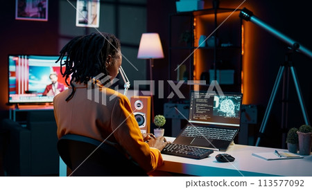 University pupil working with artificial intelligence system for machine learning, writing code in programming language. Girl uses deep learning algorithms and processing information. Camera B. University pupil working with artificial intelligence system for machine learning, writing code in programming language. Girl uses deep learning algorithms and processing information. Camera B. 113577092