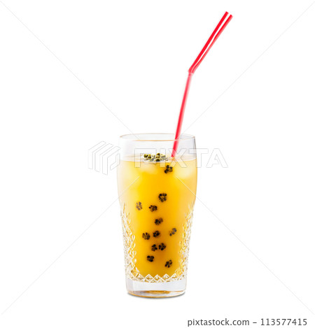 Iced passion fruit tea in a chic clear glass with passion fruit seeds and a 113577415