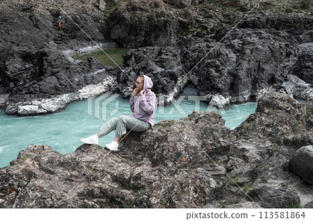 Woman at the river Katun 113581864