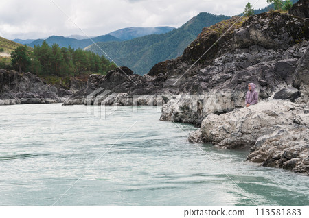 Woman at the river Katun 113581883