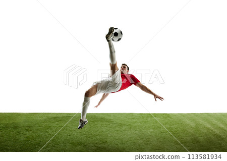 Young man, football player in motions during game, training, hitting ball and falling down isolated on white background Young man, football player in motions during game, training, hitting ball and falling down isolated on white background 113581934
