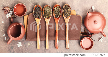 Variety of Loose Tea Leaves and Ceramic Tea Set 113581974