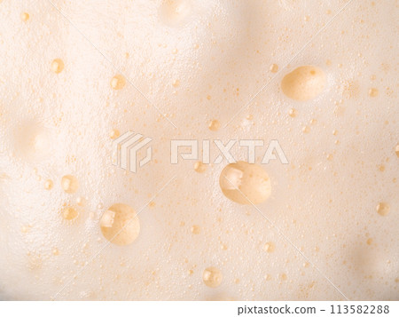 Beer or cappucino foam with bubbles texture Beer or cappucino foam with bubbles texture 113582288