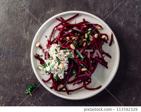 Raw beetroot noodles or beet spaghetti salad Raw beetroot noodles or beet spaghetti salad 113582326