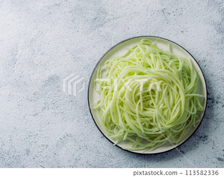 Zucchini noodles on plate. Top view, copy space Zucchini noodles on plate. Top view, copy space 113582336