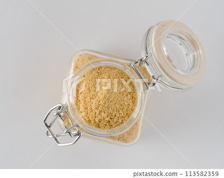 Nutritional inactive yeast in glass jar Nutritional inactive yeast in glass jar 113582359