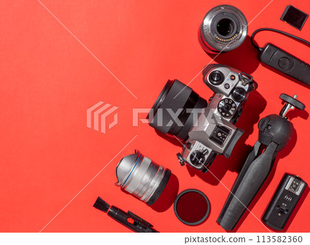 Camera and accessories on table, copy space Camera and accessories on table, copy space 113582360