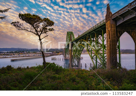 Sunset over Yaquina Bay Bridge in Newport, Oregon Sunset over Yaquina Bay Bridge in Newport, Oregon 113583247