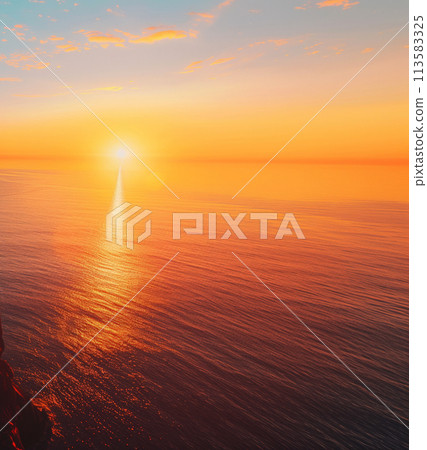 Calm sea under a vibrant sunset, with sun reflecting on water creating a tranquil scene.. Calm sea under a vibrant sunset, with sun reflecting on water creating a tranquil scene.. 113583325