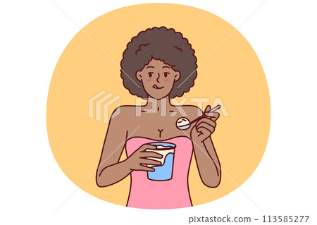 African American woman eating ice cream enjoying cold dessert to cool down after hot walk 113585277
