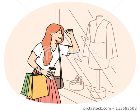 Smiling woman shopping looking in showcase Smiling woman shopping looking in showcase 113585508