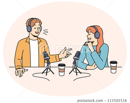 Smiling people talk in microphones on radio live 113585516