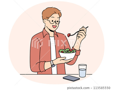 Smiling man eat salad drink water Smiling man eat salad drink water 113585550