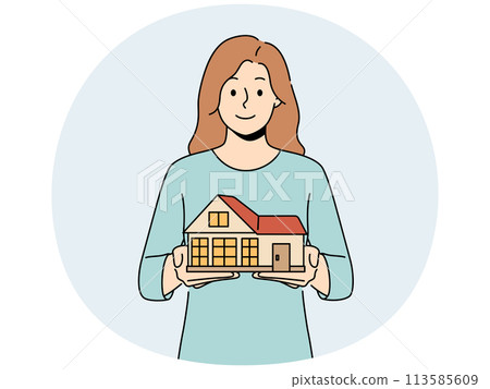 Smiling woman with house model in hands 113585609