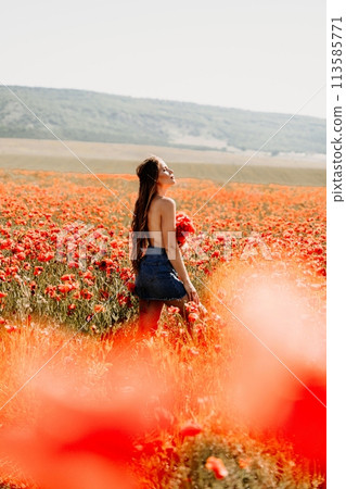 Woman poppies field. portrait happy woman with long hair in a poppy field and enjoying the beauty of nature in a warm summer day. Woman poppies field. portrait happy woman with long hair in a poppy field and enjoying the beauty of nature in a warm summer day. 113585771