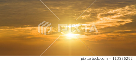 Beautiful sunrise sky with clouds . Wide photo. 113586292