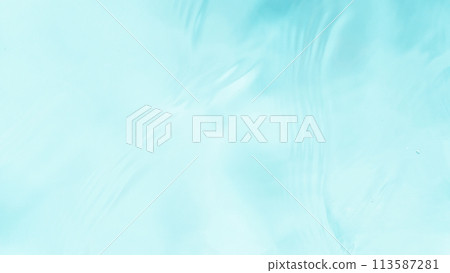Freeze motion of splashing water surface on light blue background Freeze motion of splashing water surface on light blue background 113587281