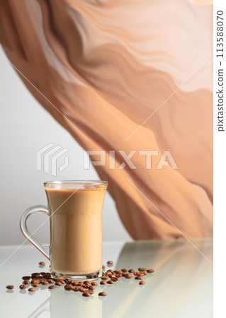 Coffee with cream on a glass table. 113588070