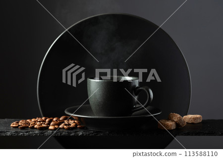 Cup of black coffee with coffee beans and brown sugar. 113588110