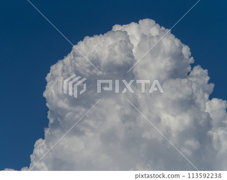 A summer sky with cumulonimbus clouds rising 113592238