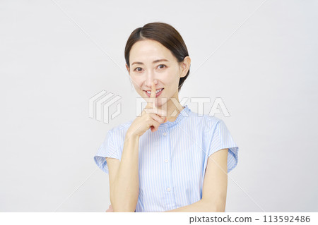 Woman doing a secret pose White background 113592486