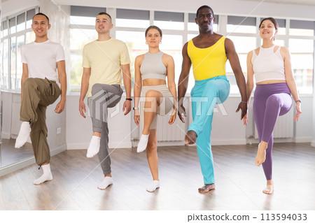 Group of adults mastering Irish dance rhythms in choreography studio Group of adults mastering Irish dance rhythms in choreography studio 113594033