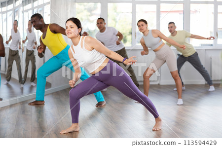 Young Asian woman practicing hip-hop dance in training hall 113594429