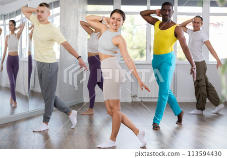 Young woman practicing jazz-funk dance in training hall 113594430