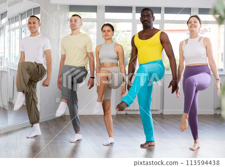 Group of motivated people mastering movements of folk Celtic dance 113594438