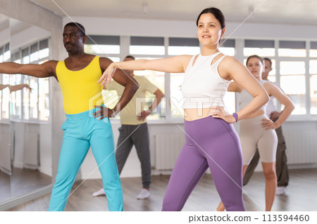 Asian woman practicing jazz-funk dance in training hall 113594460
