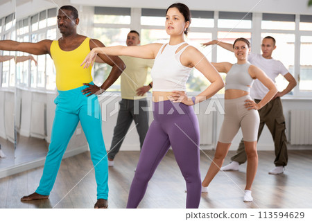 Asian girl with team of like-minded multinational people learn to elements of social dance 113594629