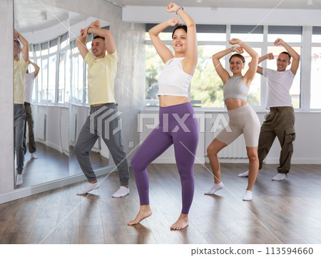 Young Asian woman practicing hip-hop dance in training hall Young Asian woman practicing hip-hop dance in training hall 113594660