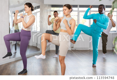 Sporty young girl in dynamic dance boxing training Sporty young girl in dynamic dance boxing training 113594748