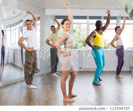 Young woman practicing aerobic dance in training hall Young woman practicing aerobic dance in training hall 113594787