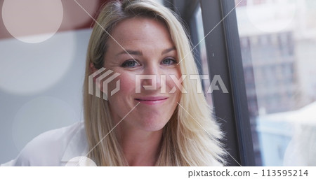 Image of spotlights over caucasian businesswoman in office Image of spotlights over caucasian businesswoman in office 113595214