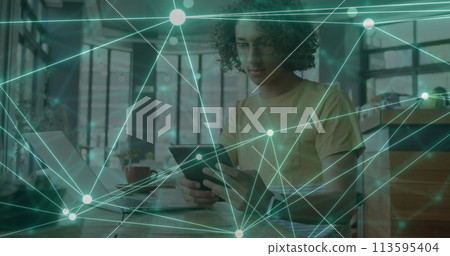 Image of network of connections over biracial man using tablet Image of network of connections over biracial man using tablet 113595404