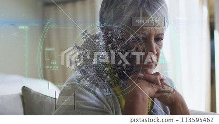 Scope scanning over covid-19 cells against thoughtful caucasian senior woman sitting at home 113595462