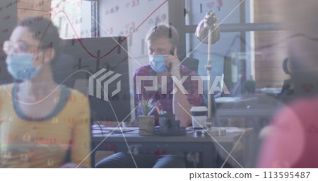 Image of statistics recording over team of colleagues in office wearing face masks 113595487