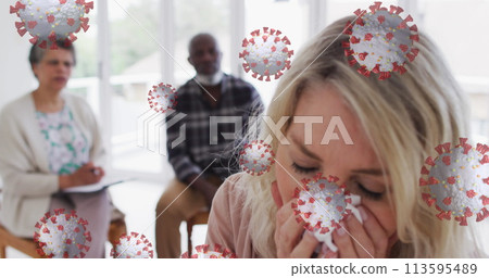Image of covid 19 cells over caucasian woman sneezing Image of covid 19 cells over caucasian woman sneezing 113595489