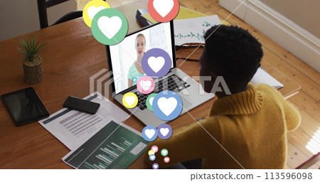 Image of digital social media heart icons over woman using laptop on image call Image of digital social media heart icons over woman using laptop on image call 113596098