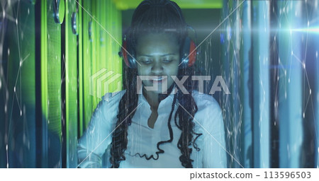 Image of connections over african american woman working in server room 113596503