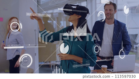 Caucasian man observes as young biracial woman uses VR 113597030