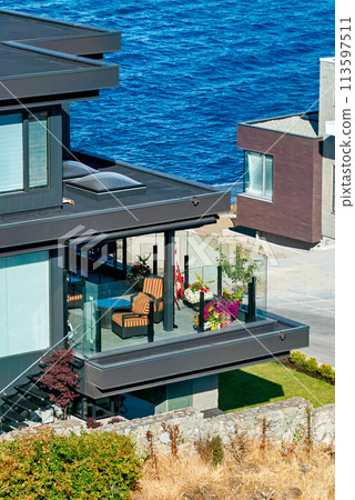A perfect neighborhood. Patio of luxury residential house on Pacific ocean shore 113597511