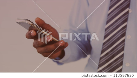Image of data processing on screen over man using smartphone 113597650