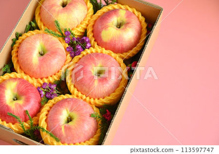 beautiful apple in the box on pink backgrond, healthy fruit beautiful apple in the box on pink backgrond, healthy fruit 113597747