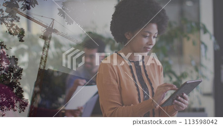 Image of afrcian american businesswoman with tablet over cityscape 113598042