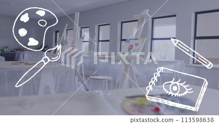 Image of palette, paint brush, pencil and sketchbook over paintings on easels in art classroom 113598638