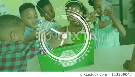 Image of clock over diverse schoolchildren recycling plastic in class Image of clock over diverse schoolchildren recycling plastic in class 113599043
