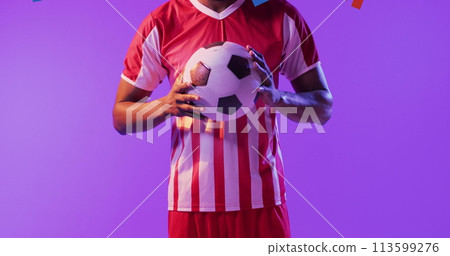African American man holds a soccer ball, with copy space African American man holds a soccer ball, with copy space 113599276